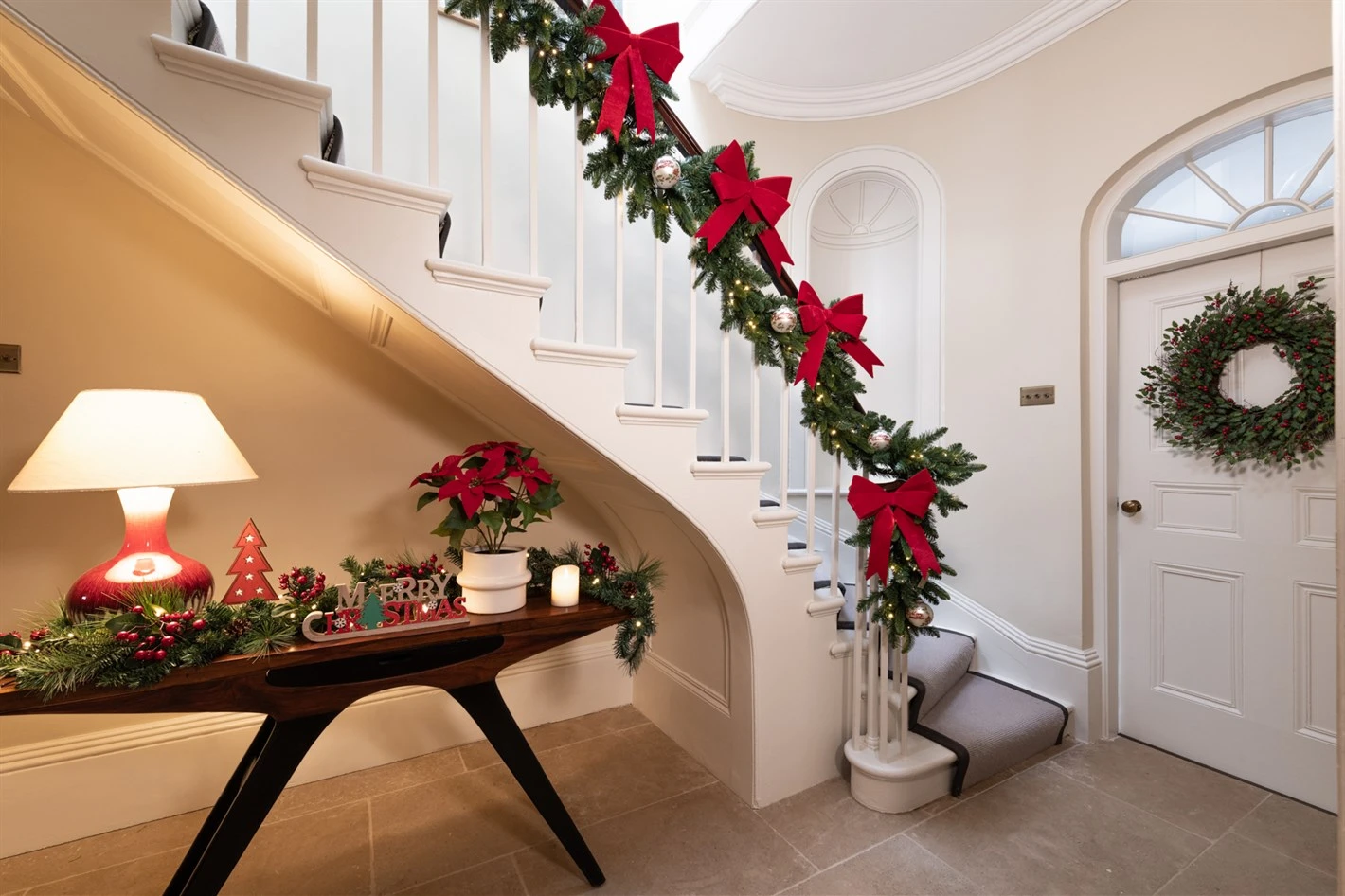 How to Hang A Garland on Your Stairs